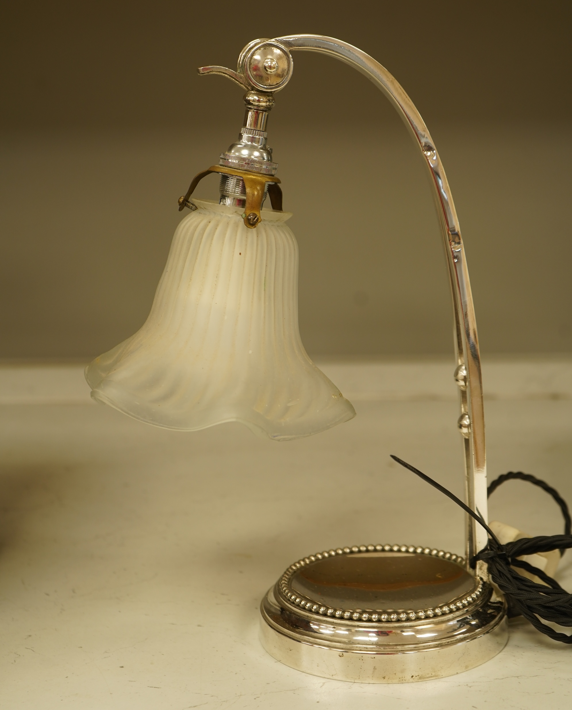A plated adjustable desk light with opaque glass fluted shade, 35cm high